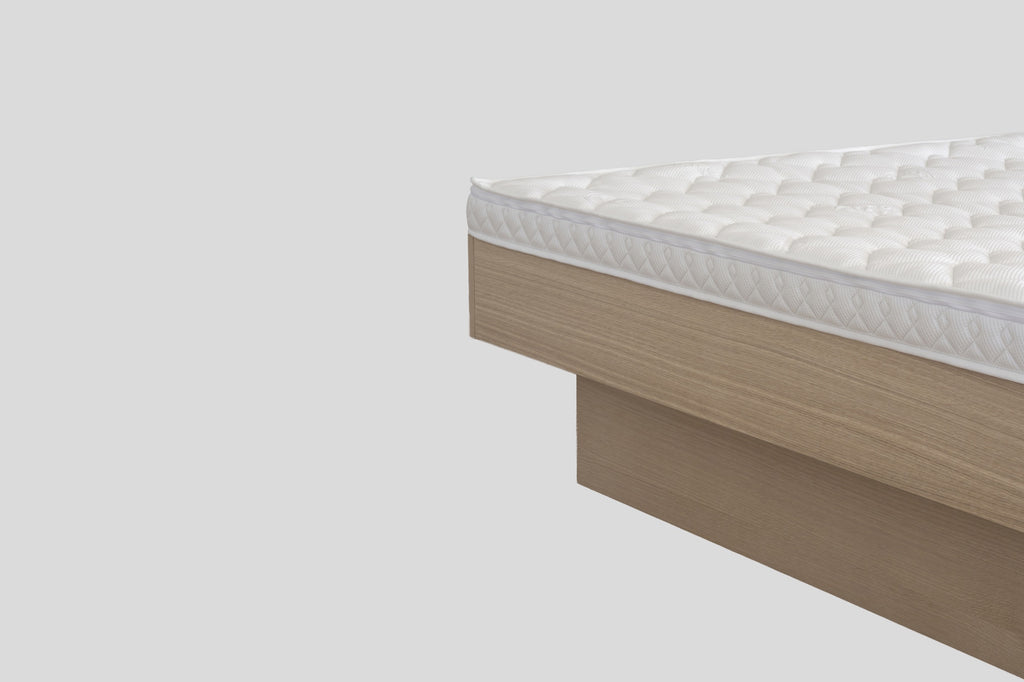 Nordic waterbed without headboard, close-up of the mattress and frame corner