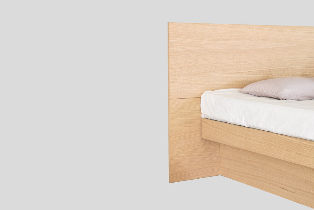 Nordic waterbed, close-up of the wooden headboard and frame